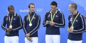 Mehdy Metella, France's Fabien Gilot, France's Florent Manaudou and France's Jeremy Stravius pose with their silver medals on the podium of the Men's 4x100m Freestyle Relay Final during the swimming event at the Rio 2016 